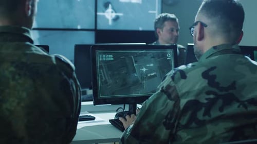 Men Working in a Military Operations Center