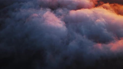Aerial View of Sunset Clouds over Mountain Summit