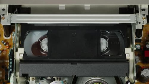 Vintage VHS Tape Moving in VCR Player