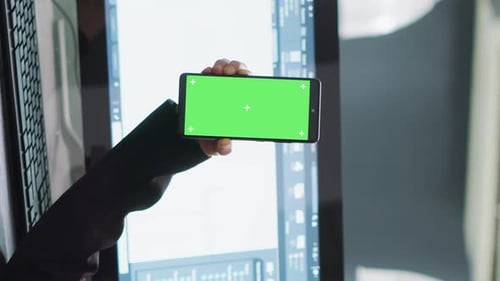 Vertical Video Developer Shows Mobile Phone with Greenscreen Template