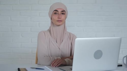 Woman Working on Laptop in Office Studio