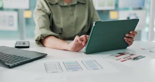 Person, hands and designer with wireframes on tablet for app design, UI or UX development in office