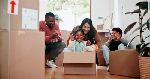 Box, couple and children with playing in real estate for mortgage, investment