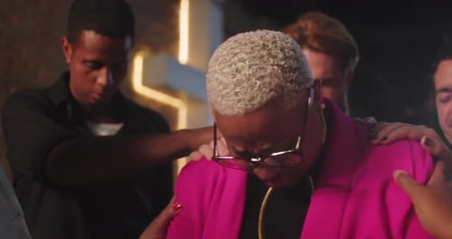 Woman Receives Support and Prayer from a Group