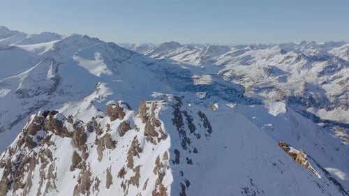 Drone Over Cross On Snowy Mountain Peak