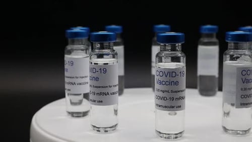 COVID-19 Vaccine Vials on Rotating Platform