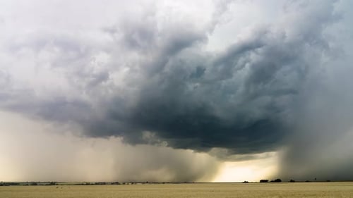 Dramatic Rainstorm Over Golden Field