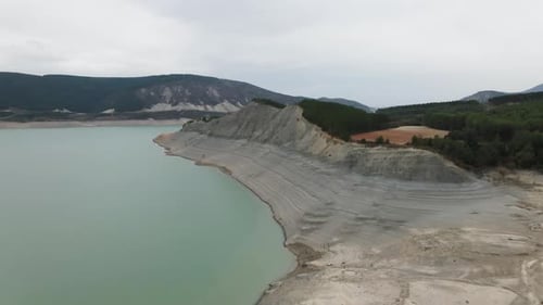 View From the Top of a Beautiful Green Lake with Mountains on Its Shores