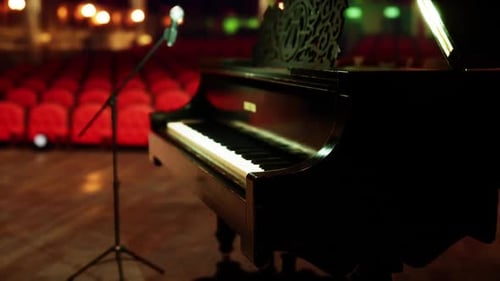 Elegant Grand Piano and Microphone on Stage with Dynamic Lighting
