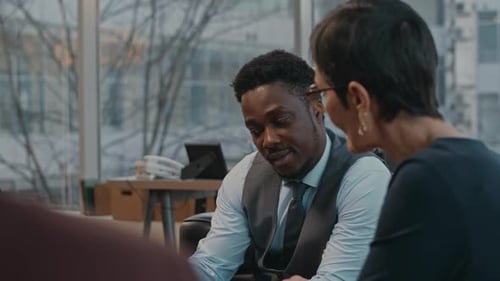 Business Partners Discussing Contract at Office Meeting