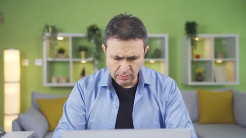 Home office worker man. He is not satisfied with the way his job is going.