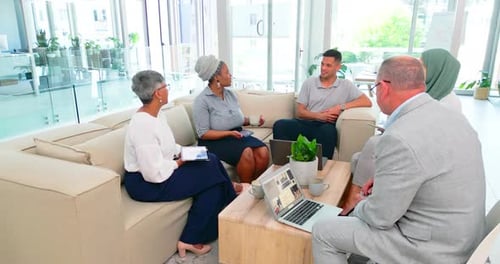 Diverse Group Meeting in Modern Office Setting