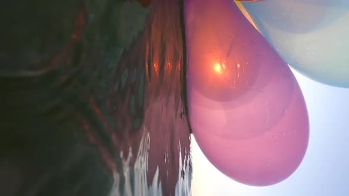 Bunch Airy Multicolored Balloons Swing Waves Sea on a Sunny Summer Day Vertical