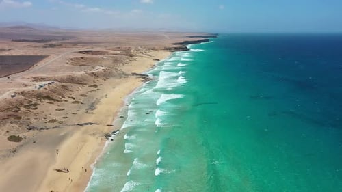 Aerial Drone View of Kitesurfers and Surfers at Playa del Castillo, Fuerteventura, Canary Islands