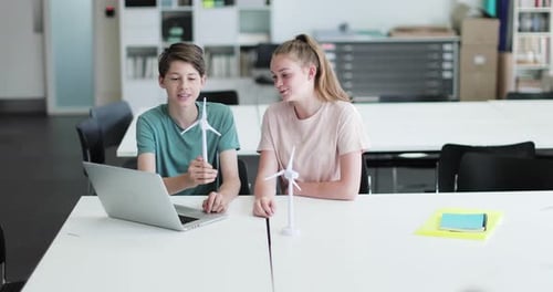 High school students studying renewable energy