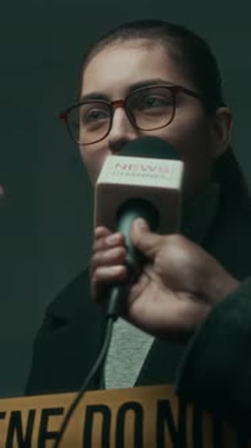 Woman Interviewed near Crime Scene Tape