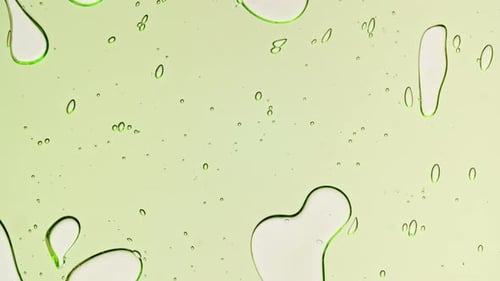Abstract Green Liquid Forming Bubbles and Shapes