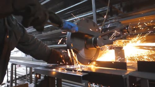 Industrial Worker with Circular Saw Sawing Steel in Workshop Man in Safety Protection Wear Use Saw