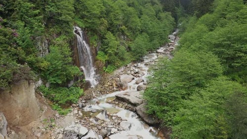 Wonderful waterfall flowing through the valley
