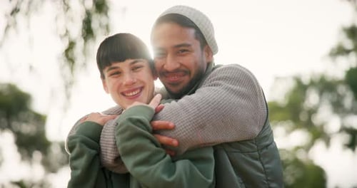 Couple Smiling and Embracing Outdoors