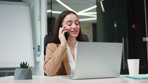 Successful Female Manager Talking on Smartphone in Personal Office Cabinet
