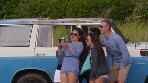 Friends taking a beach selfie on a sunny summer vacation together
