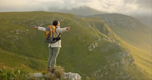 Woman, mountain top and freedom, trekking goals, celebration or travel achievement in nature