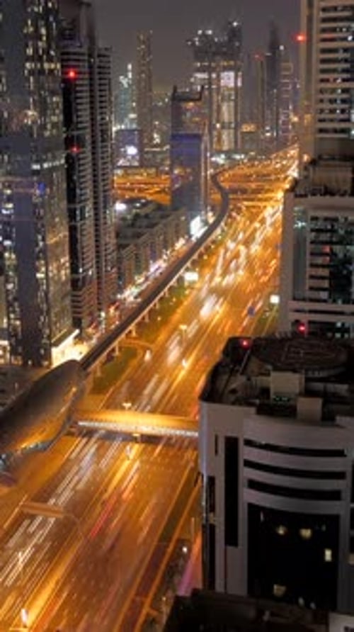 A Vibrant Night Cityscape Featuring Striking Light Trails Across the Skyline and Streets