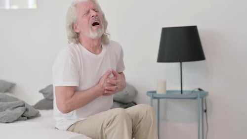 Old Man with Chest Pain Sitting on Side of Bed, Heart Attack