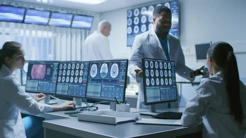 Team of Medical Scientists Work in the Brain Research Laboratory. Neurologists / Neuroscientists Ha