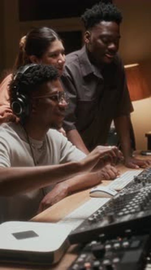 Music Producer with Band in Recording Studio Vertical