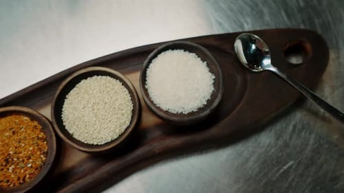 close-up of oriental spices standing on a metal counter in a professional kitchen in an restaurant