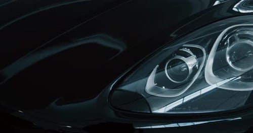 Close up of details of headlights of anonymous prestigious luxury modern car. Shot in 8K. Concept