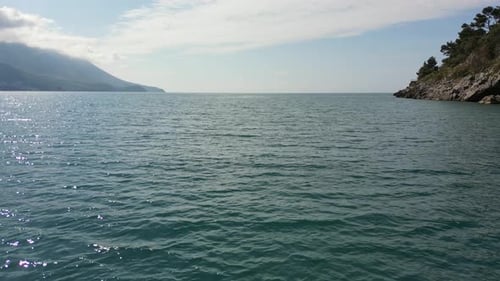 The drone flies over the sea. Beautiful clear water of the Adriatic Sea off the coast of Croatia