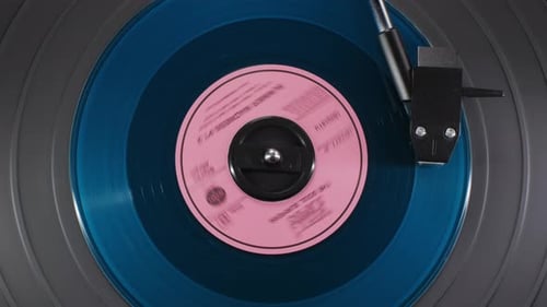 Blue Vinyl Record Spinning on Turntable