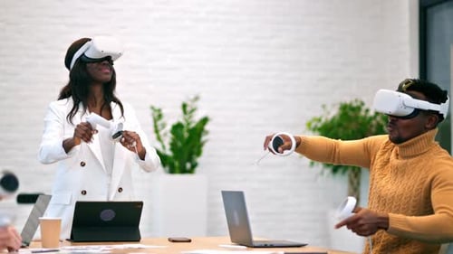 Female team leader at business conference in VR in an office. Multiracial group of people using VR g
