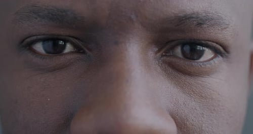 Man's Eyes Staring in Extreme Close-Up