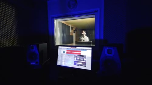 Man Recording Music in a Professional Studio