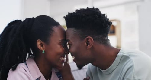 Affectionate Couple Kissing and Nuzzling Indoors