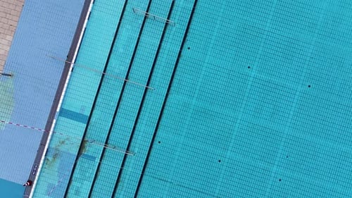 Aerial view of empty public pool with geometric lines, Germany.