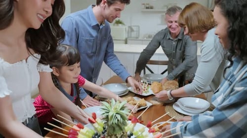 Family Gathering Around Table for a Joyful Meal