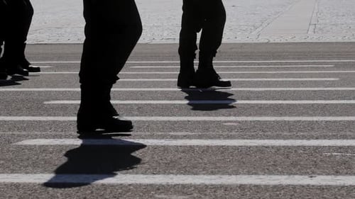Soldiers march in formation at a ceremony