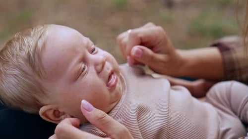 Close-up Of Adorable Infant Playing With Mother