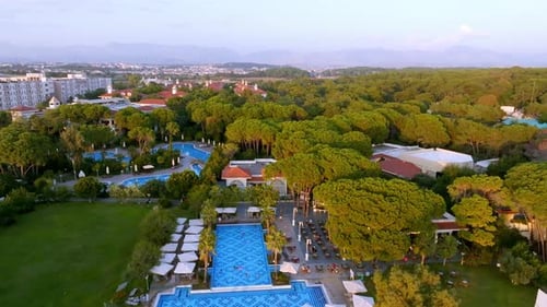 Luxurious Beach Resort with Swimming Pool and Beach Chairs and Palm Trees