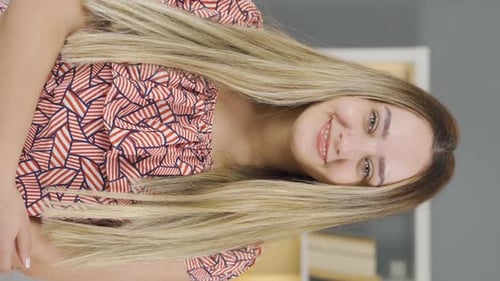 Smiling Woman with Long Blonde Hair Talking