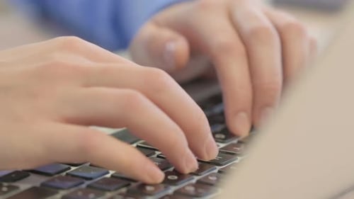 Close up of Female Hand Typing on Laptop