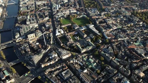 Dublin Aerial Cityscape, Ireland. Downtown by River Liffey, Trinity College Park and Buildings on Su