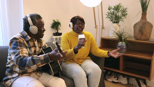 Musical Senior Couple Singing Together At Home