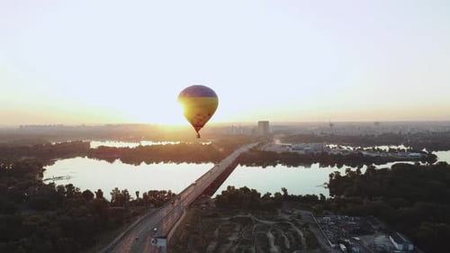Scenic Hot Air Balloon Over City at Sunrise