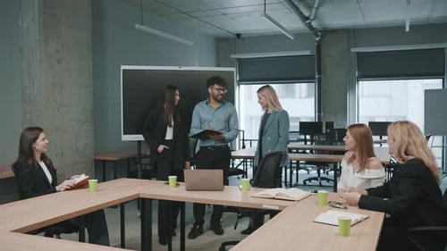 Engaged team collaborates in modern office space during productive meeting